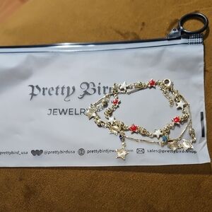 Pretty Bird NWOT Gold Plated Star Charm Bracelet with Red, White & Blue Accents